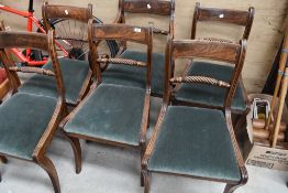 A set of six (five plus one) Regency mahogany dining chairs having turned twist rail back on