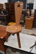 An Arts and Crafts traditional golden oak spinning chair/stool, by John Chapman