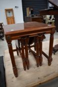 A nest of reproduction continental style tables.