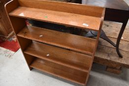 An early to mid 20th Century golden oak low bookshelf, width approx. 77cm