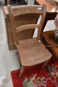 A 19th Century solid seat kitchen chair