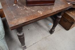 An early 20th century drawer leaf oak table