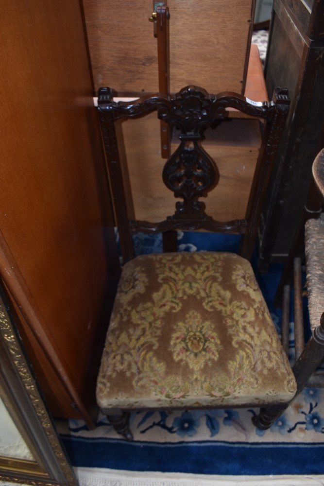 A Victorian mahogany salon/nursing chair having overstuffed seat