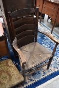 A traditional ladderback carver chair having rush seat