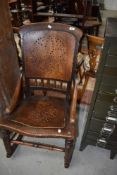 A Victorian rocking chair having ply back and seat
