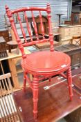 A Victorian spindle back kitchen dining chair , having turned frame, later painted in red