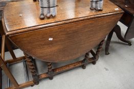 An early to mid 20th Century oak twist gateleg dining table