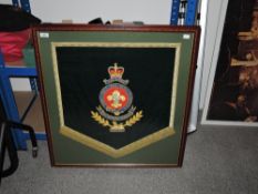 A framed military The Kings' band drape showing 'The Kings' badge 22" x 24"