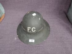 A WW2 Black Fire Guard Helmet, FG on front and back, marked inside 281M SNA 9/41, marked leather