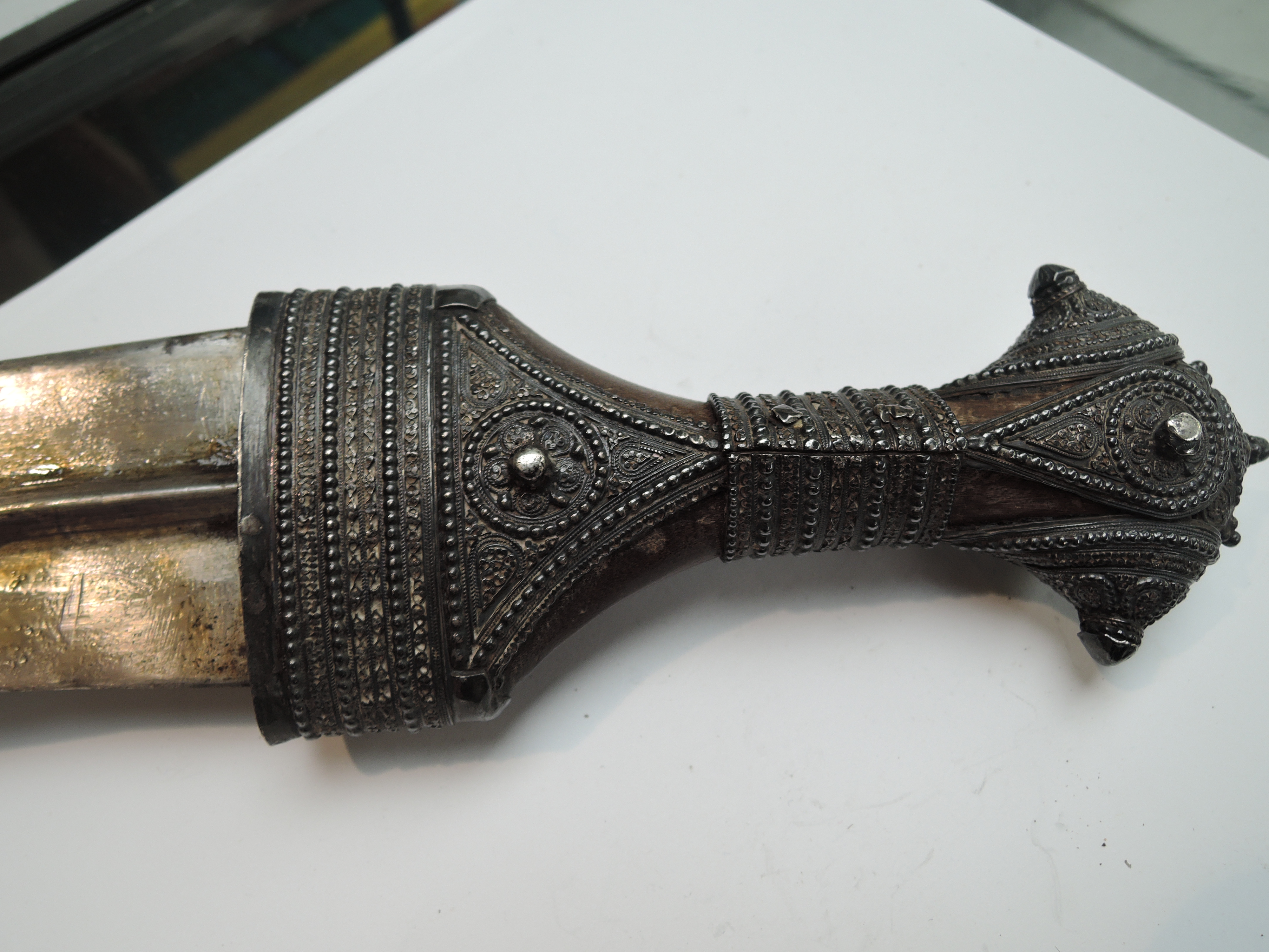 A middle eastern Khanjar/Jambiyya possibly 19th century having wood handle and being highly - Image 3 of 3