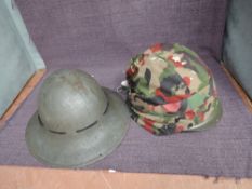A WW2 British Military Tin Helmet having inner lining marked S.M.Limited 1941 7 along with a later