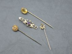 A 15ct gold amethyst and seed pearl bar brooch, damaged, 1.8grams sold along with a 9ct gold Masonic