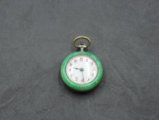 A small Swiss silver top wound pocket watch having red Arabic numeral dial to white face in green