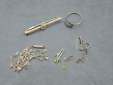 A small selection of yellow metal, most stamped 9ct including fine chain, dress ring, bar brooch and