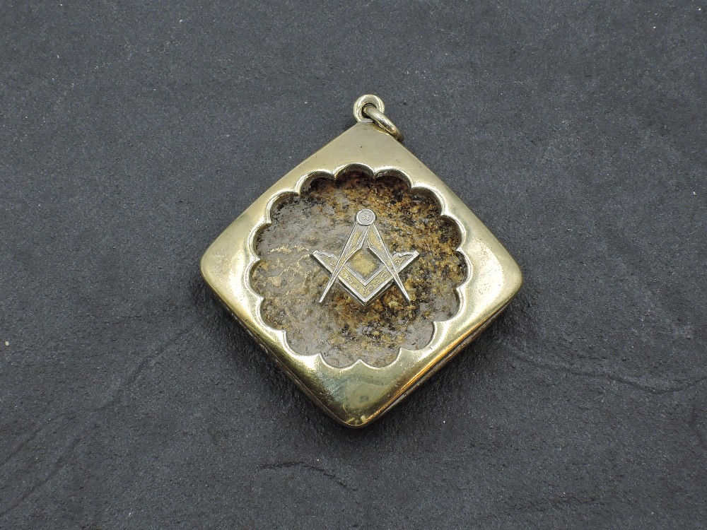 A silver gilt pendant of Free Mason interest, approx 10.9g
