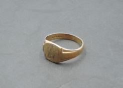 A gent's 9ct rose gold signet ring bearing monogram and moulded shoulders, size W/X & approx 6.8g