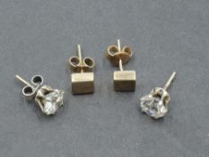 Two pairs of yellow metal and 9ct gold stud earrings