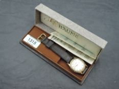 A 1950's Baume gold-tone 21 jewel wristwatch, with Arabic and baton markers, stitched leather strap,