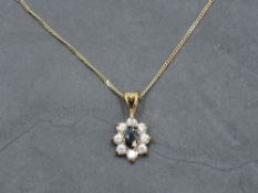 A sapphire and CZ cluster pendant in 9ct gold mount on 9ct gold chain, approx 18' & 2g