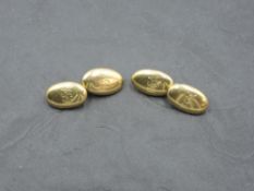 A pair of 18ct gold cufflinks of oval cushion form bearing monograms with chain connectors, approx