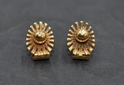 A pair of 9ct gold clip earrings of sun burst form, approx 4.1g