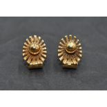 A pair of 9ct gold clip earrings of sun burst form, approx 4.1g