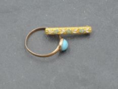 A yellow metal and turquoise children's ring, indistinct mark to shank, size I/J, 0.9grams sold