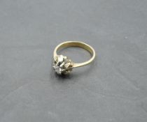 A diamond solitaire dress ring, approx 0.125ct in a stylised white and yellow metal mount to knife