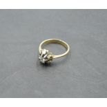 A diamond solitaire dress ring, approx 0.125ct in a stylised white and yellow metal mount to knife