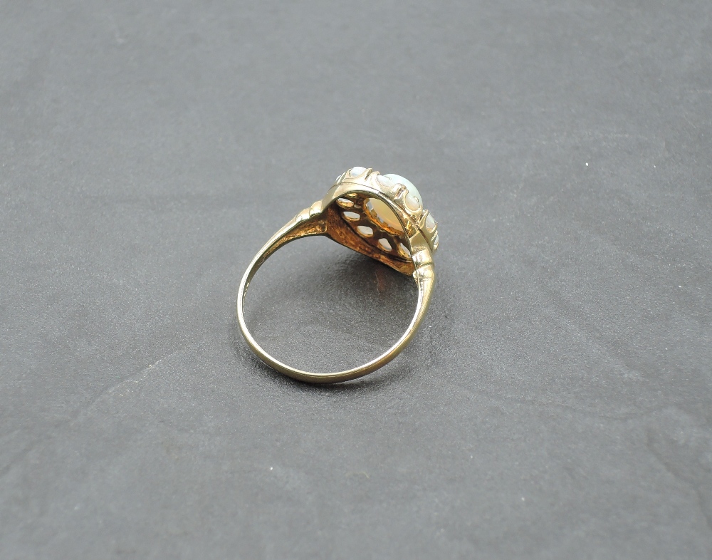 An oval opal cluster ring in a stepped claw mount on a 9ct gold loop, size R & approx 1.7g - Image 2 of 3