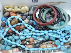 A selection of polished stone/mineral and horn jewellery including bangles, bracelet and necklaces