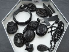 A selection of black mourning jewellery including lockets, necklace, bracelet. Brooches, pendants
