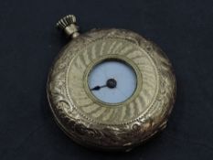 A small yellow metal top wound half hunter pocket watch stamped 18K having Roman numeral dial and