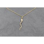 A 9ct gold snake pendant on a 9ct gold fine rope chain, approx 18' & 2.9g