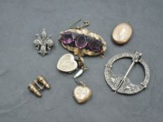 A Pinchbeck and purple stone brooch, a white metal Celtic design annular kilt pin marked 'silver', a