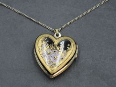 An enamelled heart shaped locket by Michaela Frey, with original box