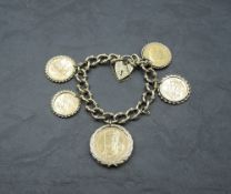 A 9ct gold fancy link bracelet with padlock clasp having two gold sovereigns in detachable mounts,