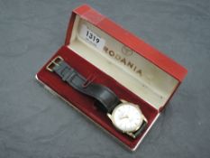 A gent's 1960's 9ct gold automatic wrist watch by Rodania having baton numeral dial to champagne