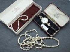 A selection of jewellery including two strings of cultured pearls with white metal clasps stamped