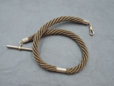 A Victorian plaited hair watch chain with yellow metal fittings and clasp stamped 9C, approx 26'