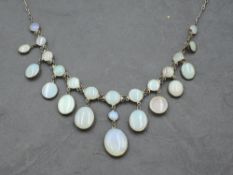 An early 20th Century silver and moonstone necklace having circular moonstone cabochons in bezel