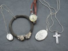 Two white metal lockets and a cross pendant, all stamped silver, a woven white metal bangle with