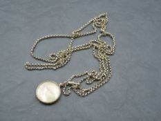 A yellow metal belcher link muff chain bearing plaque stamped 9C, with a rolled gold glass locket,