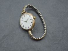 A gent's vintage 9ct gold wrist watch by Longines bearing no:4014163 to case, having Roman numeral