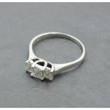 A princess cut diamond trio dress ring, total approx 0.65ct in a claw set stepped looped mount on an