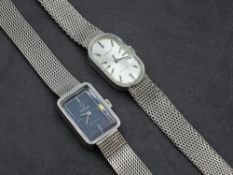 A lady's Omega De ville steel wrist watch having plain navy face in rectangular case on steel