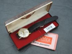 A gent's 1960's gold plated wrist watch by Roamer having baton and Arabic numeral dial and