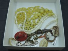 A small selection of mainly vintage costume jewellery including mother of pearl beads, conch shell