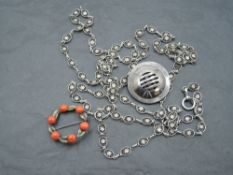 Three pieces of white metal jewellery stamped 800 and bearing marks including a coral brooch,