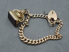 A rose gold curb chain bracelet stamped 9ct having padlock clasp and rolled gold watch fob, GW 17.